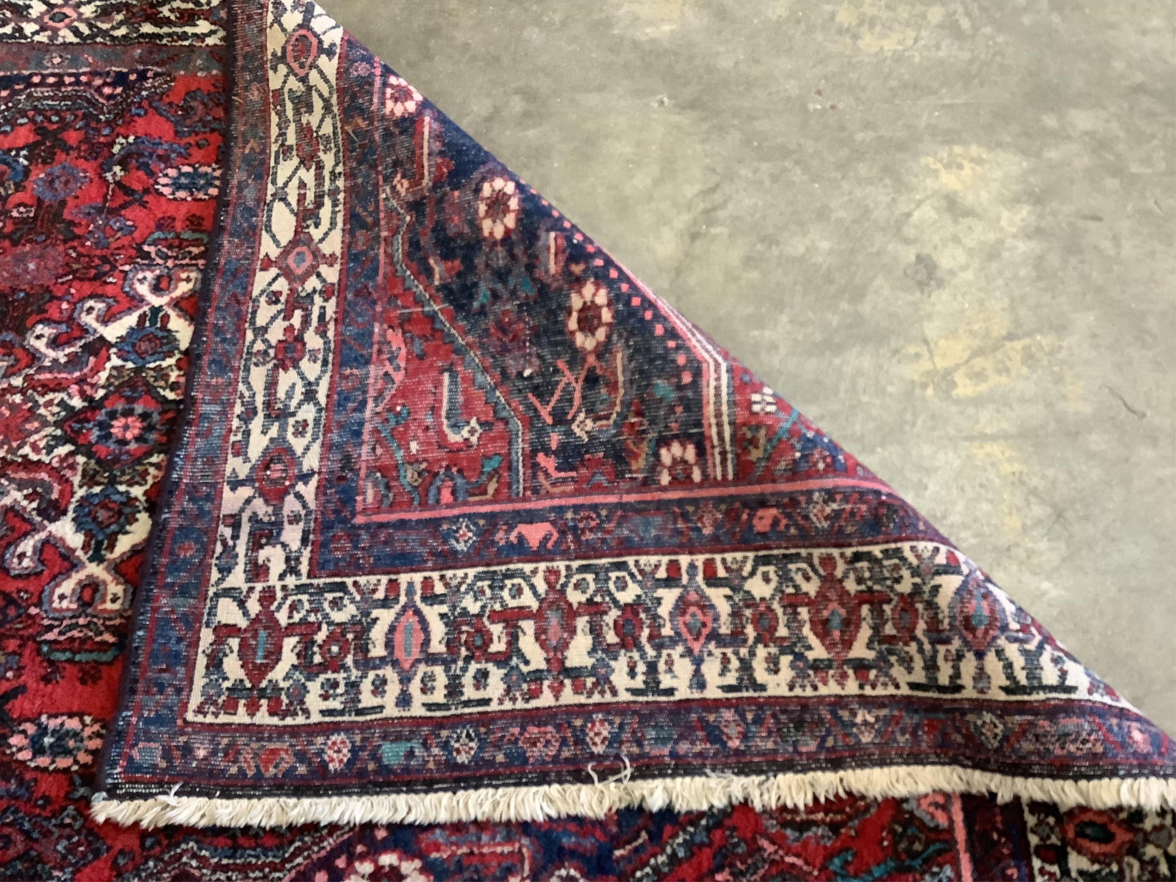 A Hamadan rug, 215 x 130cm and a Malayer rug, 190 x 125cm. Condition - poor to fair